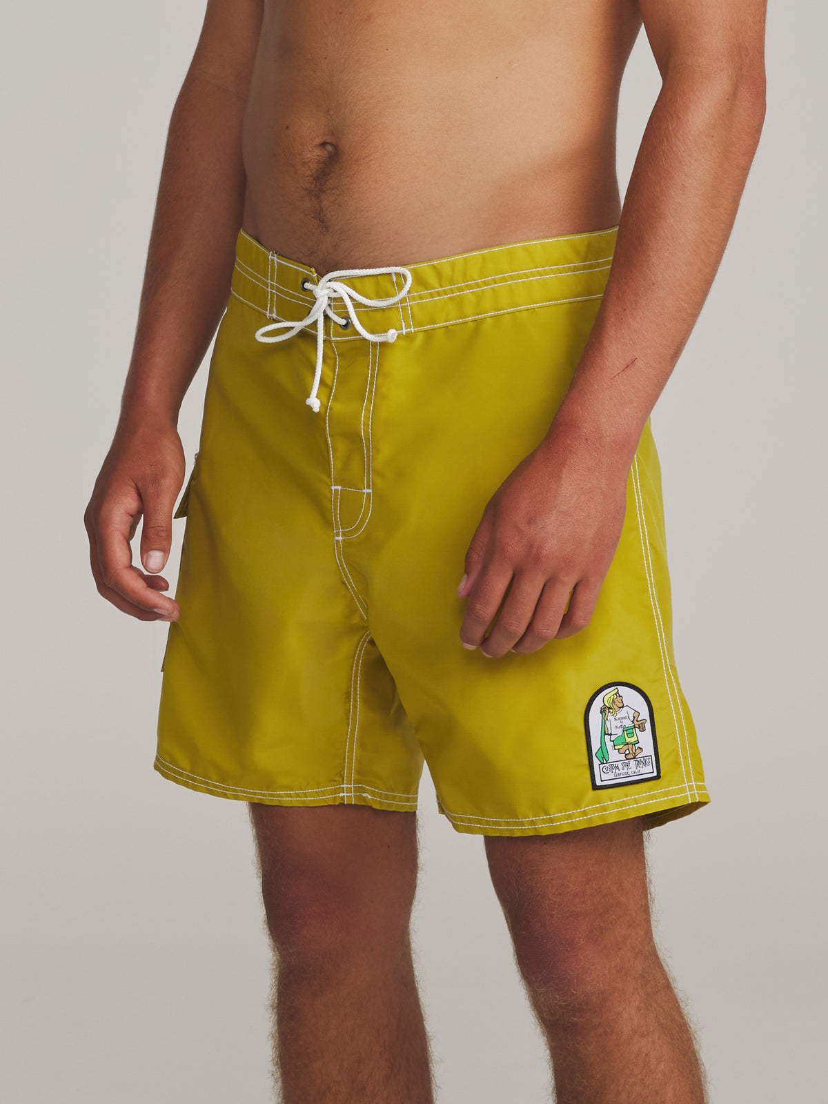 Katin Waterman Trunk in Lime, on model, side #color_lime