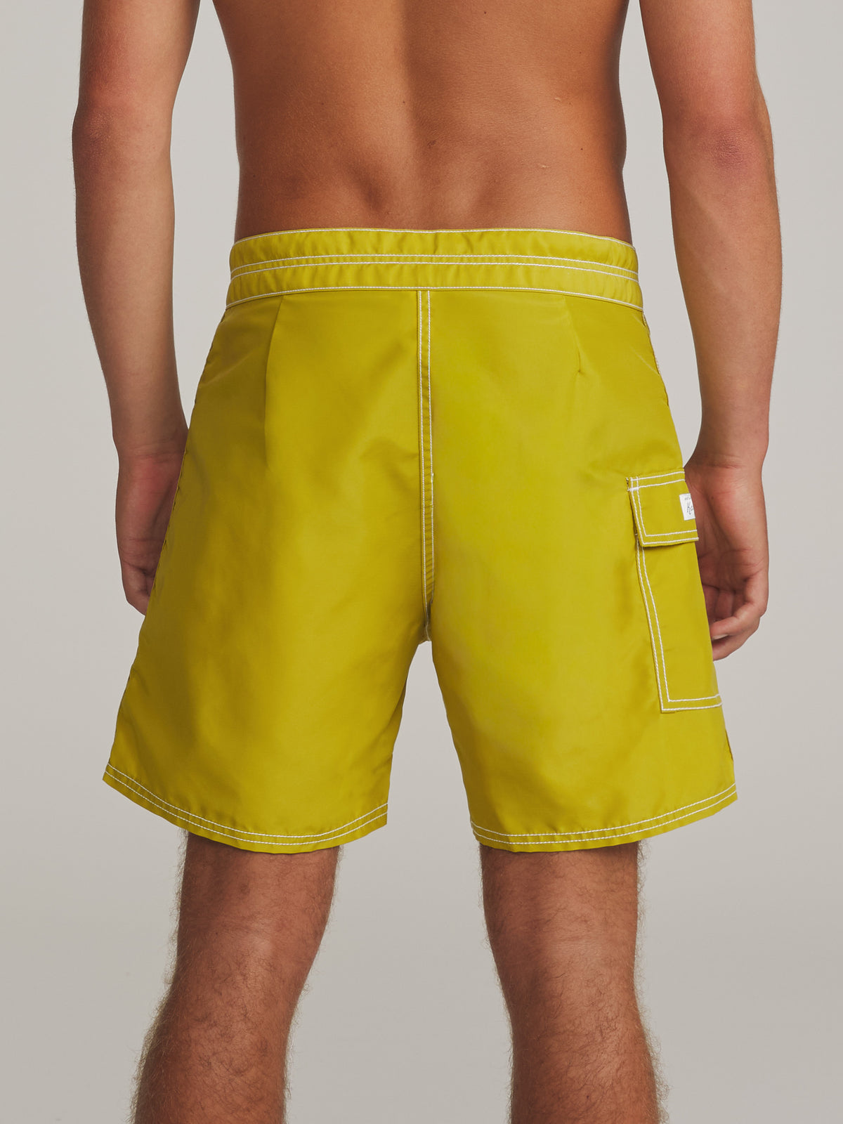 Katin Waterman Trunk in Lime, on model, back 2 #color_lime