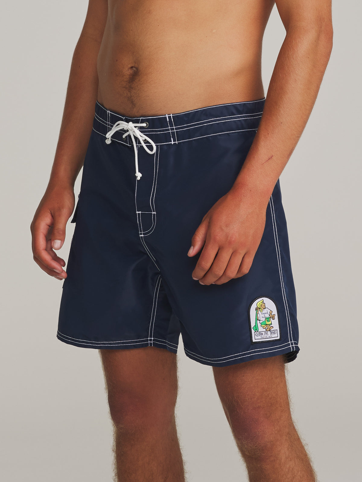 Katin Waterman Trunk in Navy, on model, side #color_navy