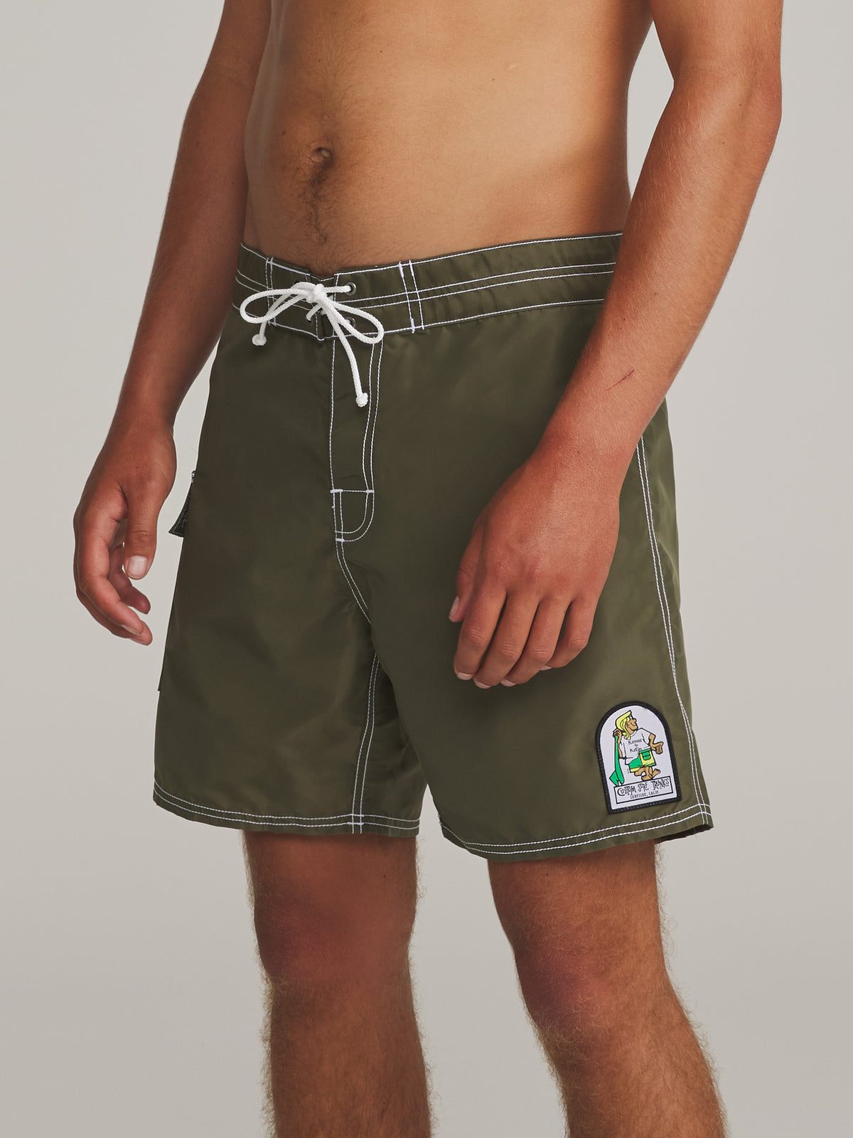 Katin Waterman Trunk in Olive Night, on model, side #color_olive night