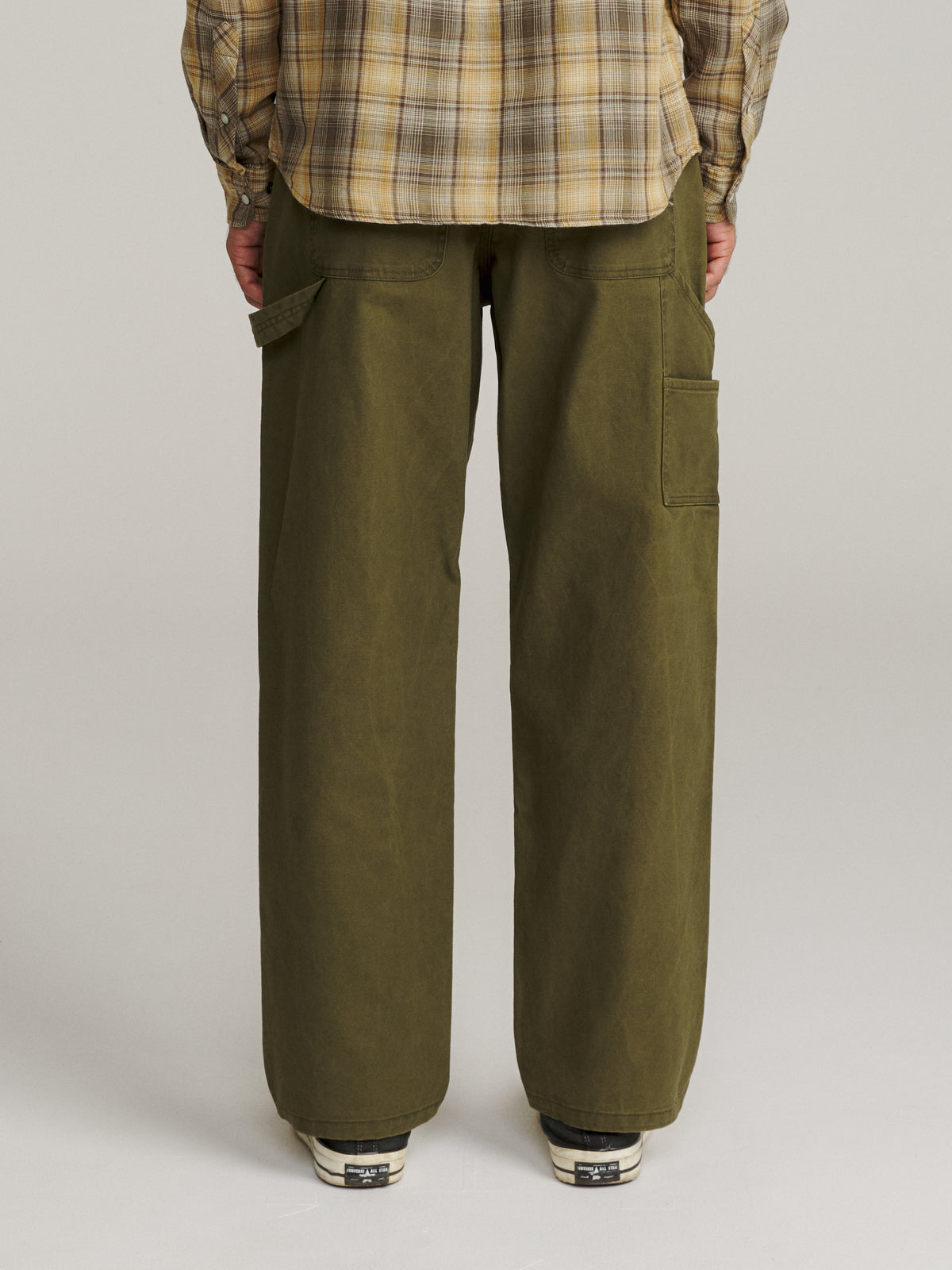 Katin Stanley Pant in Olive canvas, on model, back #color_olive