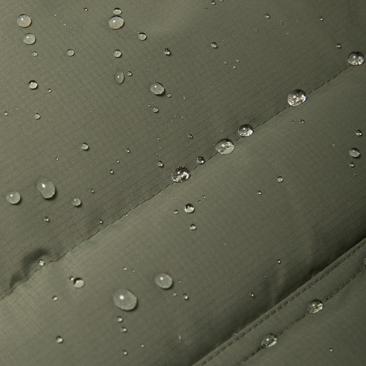 Katin OTG Summit Hooded Down Puffer in Thyme with a stacked fill pattern, waterproof detail #color_thyme