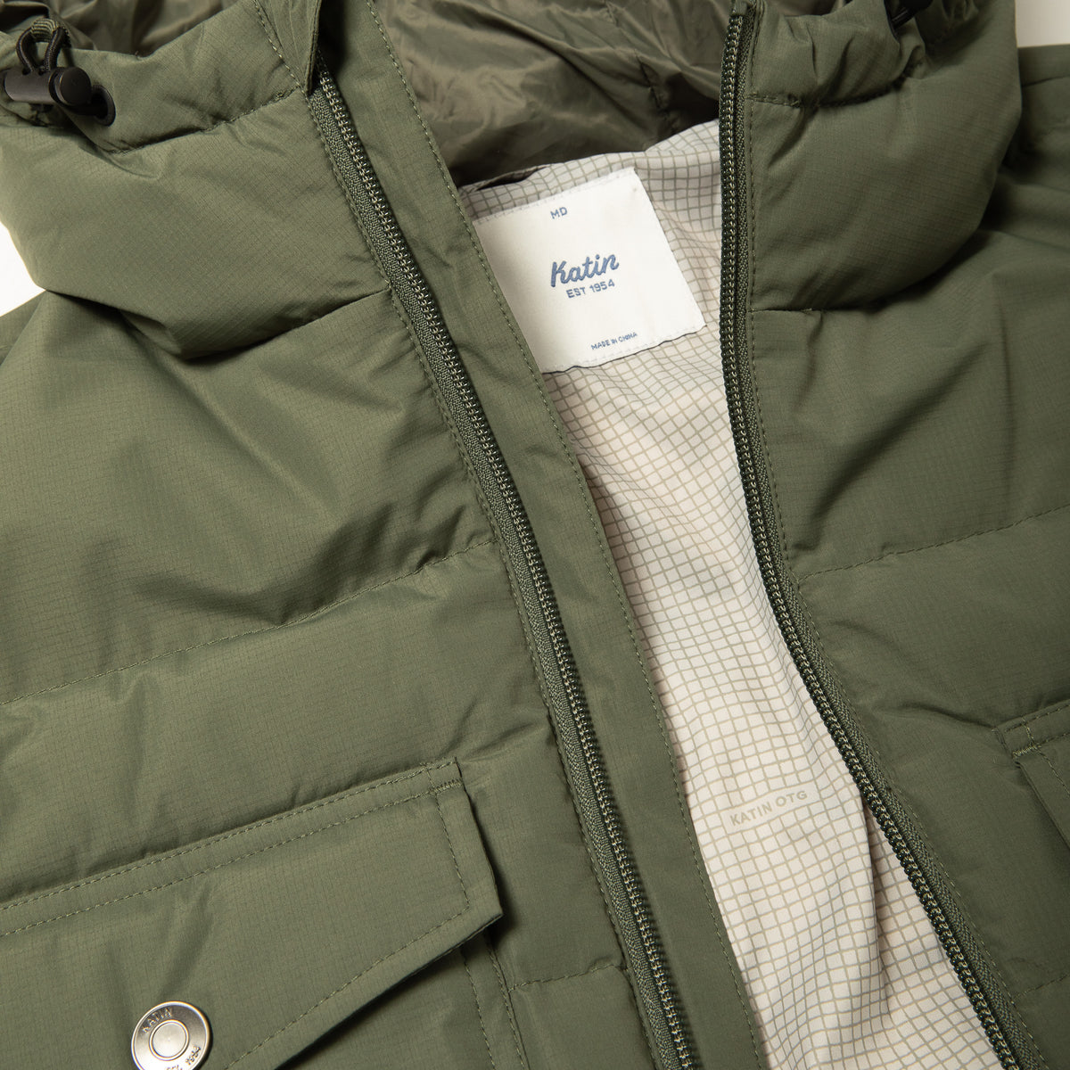 Katin OTG Summit Hooded Down Puffer in Thyme with a stacked fill pattern, detail, front #color_thyme