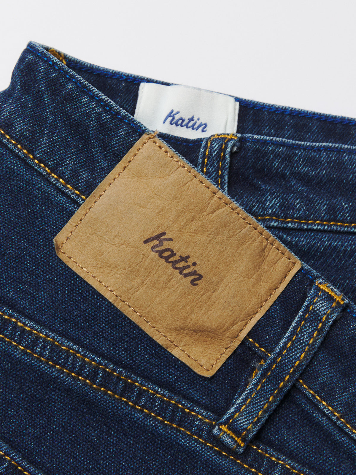 Katin George 64 Relaxed in Dark Indigo denim, flat, Katin patch detail #color_dark indigo