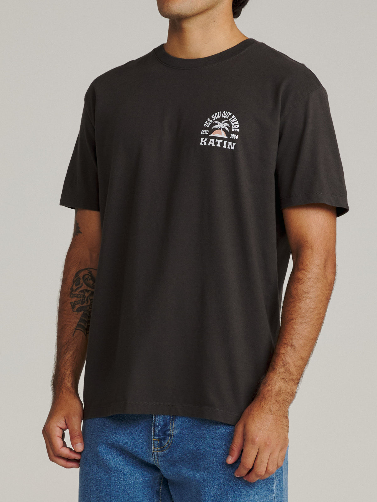 Katin Nosara Tee in Black Wash midweight jersey, on model, side #color_black wash