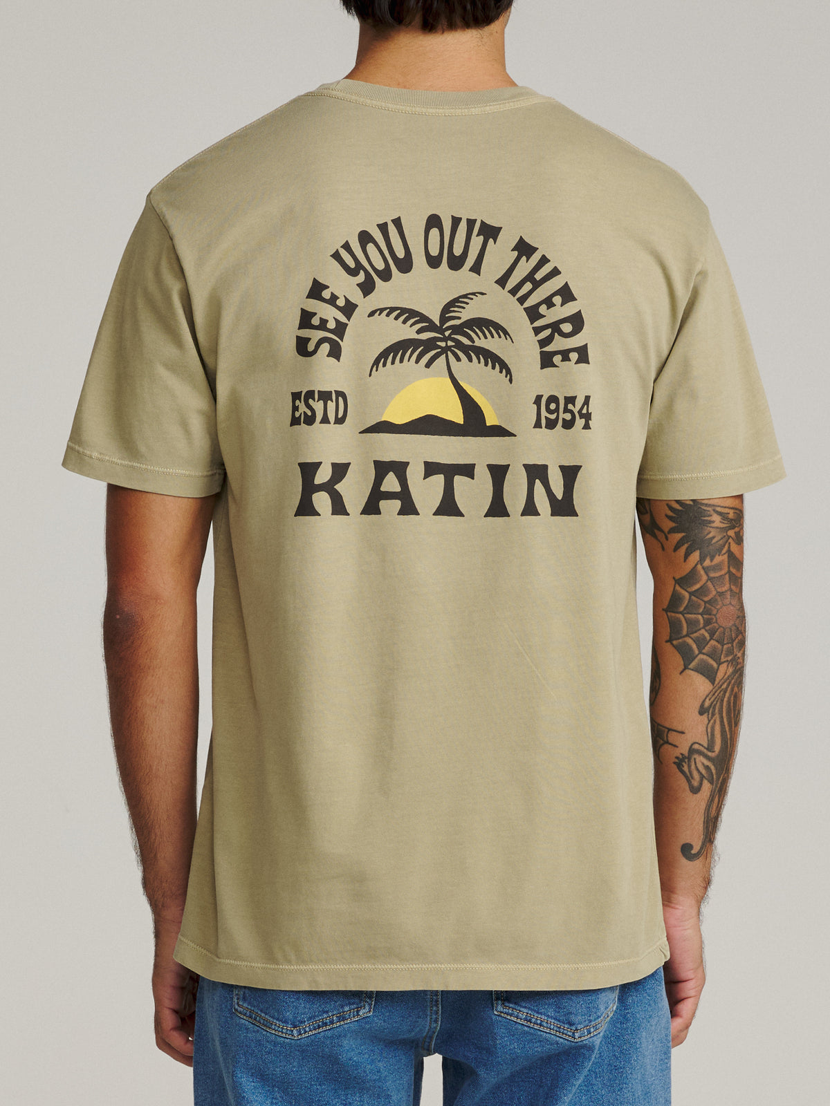 Katin Nosara Tee in Covert Green Vintage Wash, on model, back #color_covert green vintage wash