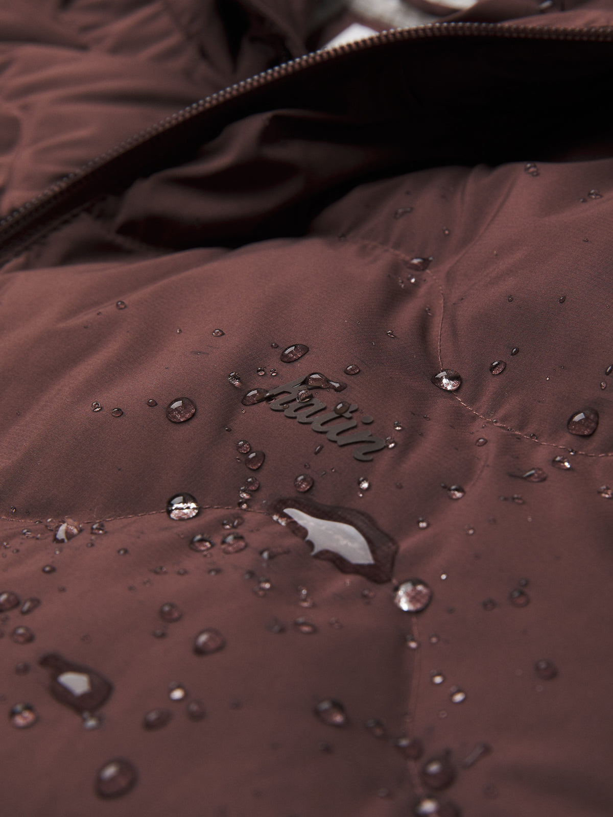 Katin OTG Henson Hooded Puffer in French Roast, flat, logo and water proof detail #color_french roast