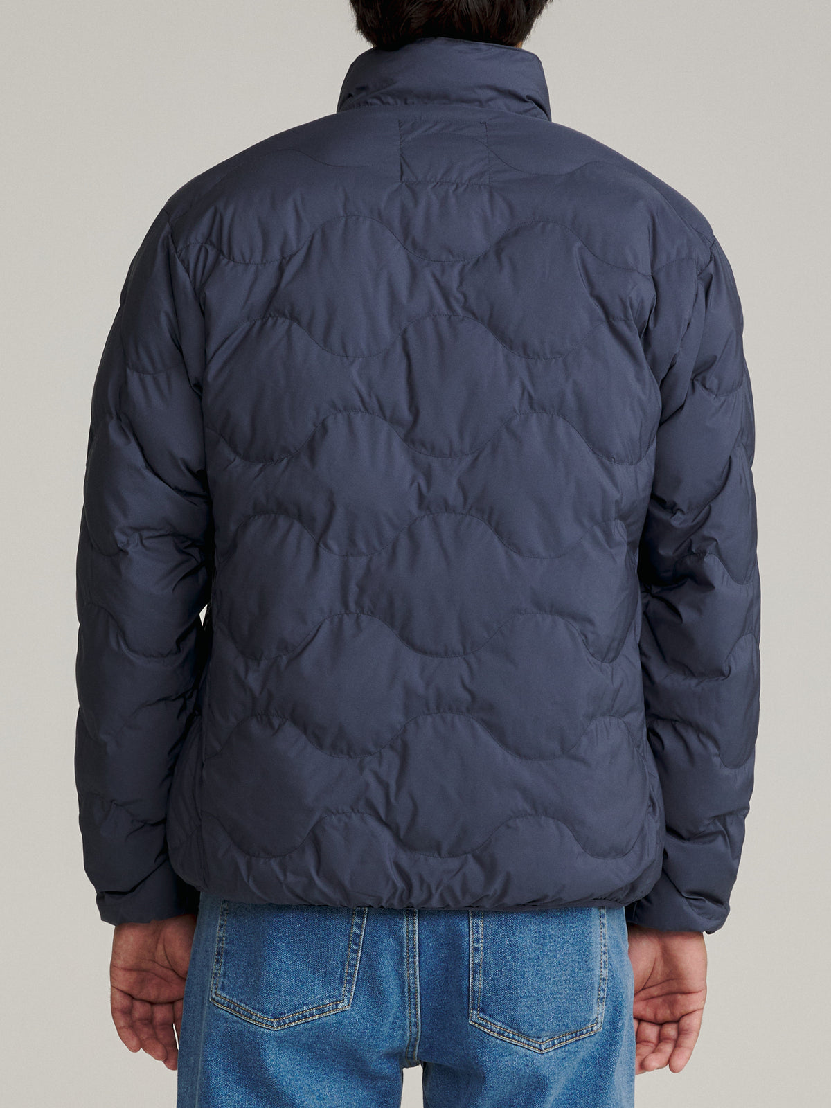 Katin OTG Ross Puffer in Washed Blue with an onion quilt pattern, on model, back #color_washed blue