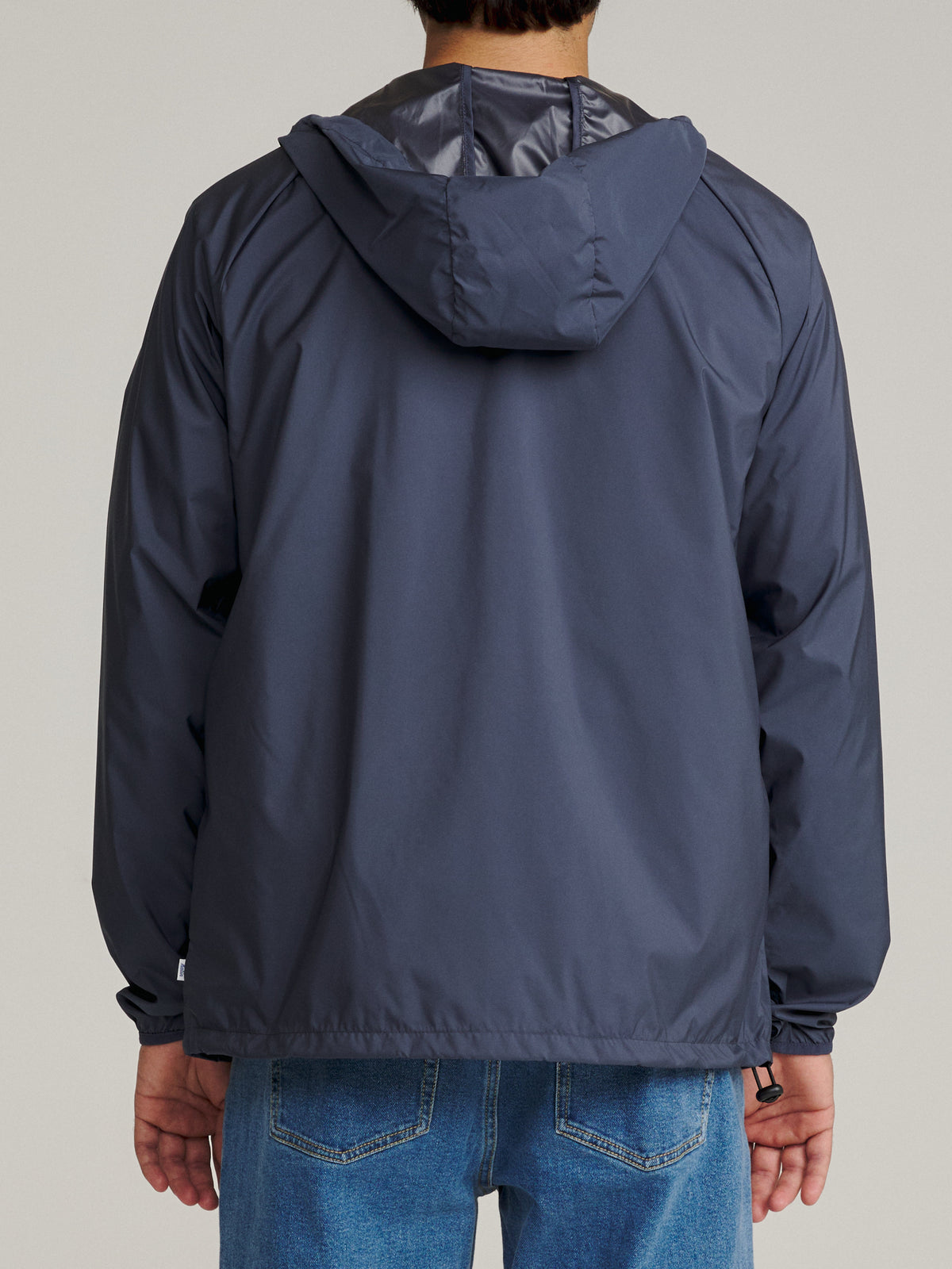 Katin OTG Shadow Jacket in Washed Blue Katin logo at left chest, on model, back #color_washed blue