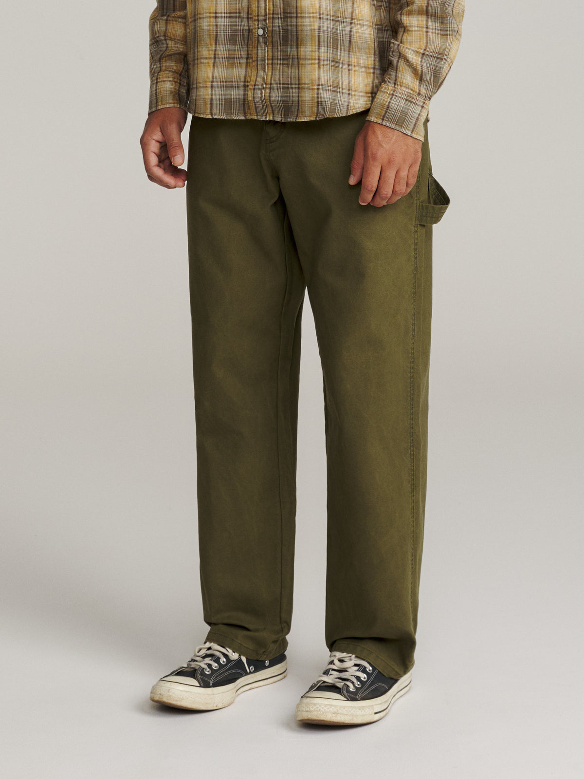 Katin Stanley Pant in Olive canvas, on model, side #color_olive