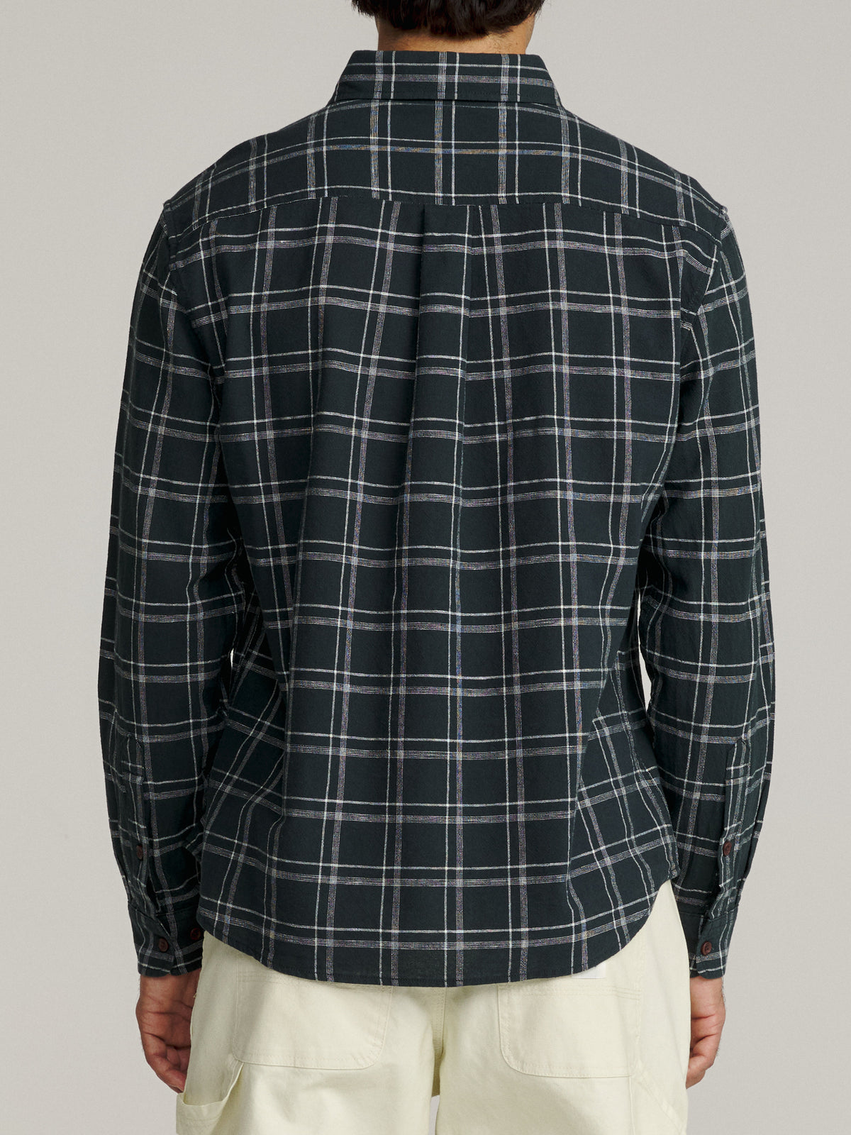 Katin Tack Shirt in Black with a simple two-color plaid, on model, back #color_black
